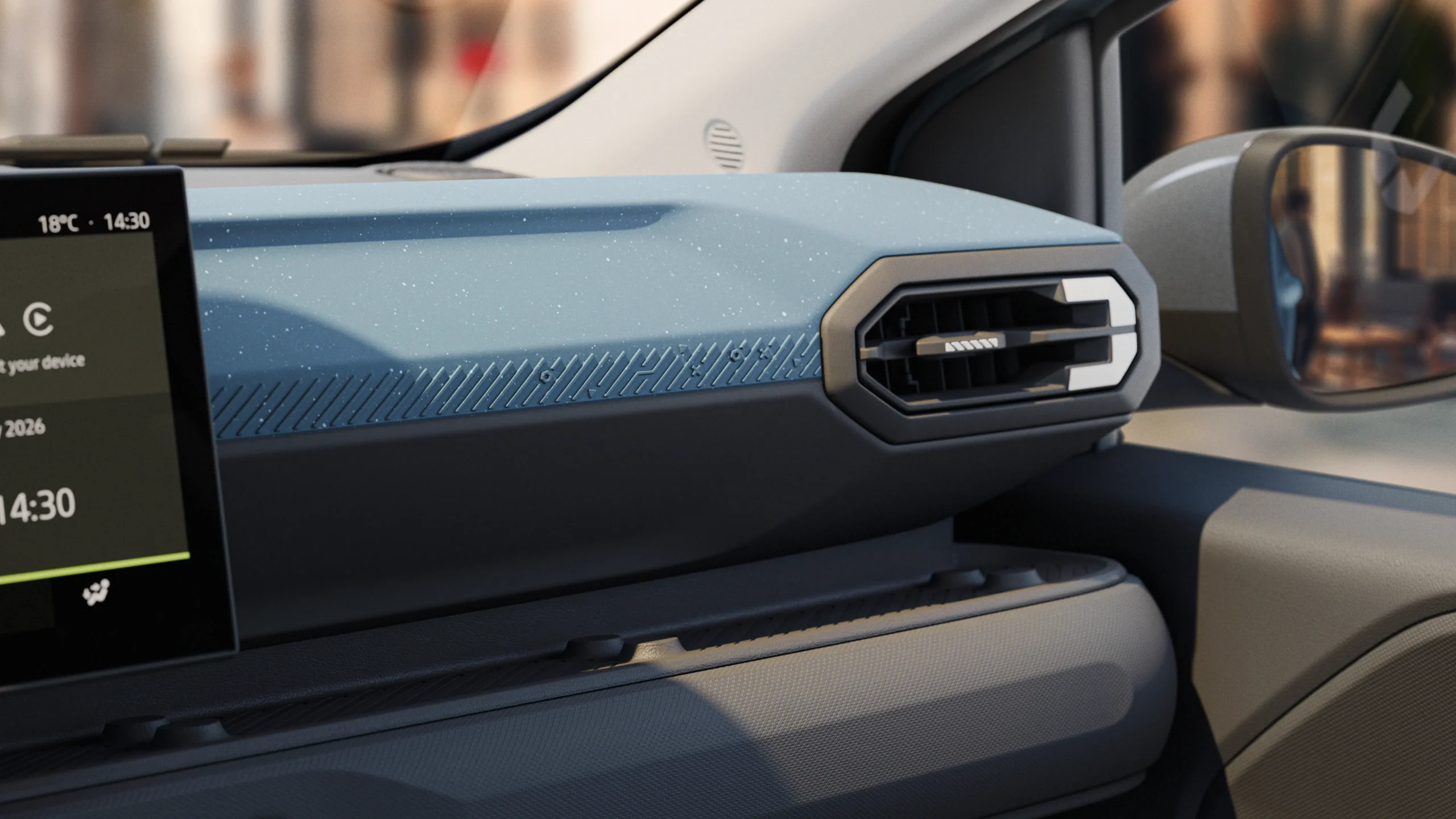Dacia Spring estrena su segunda generación, más robusta y tecnológica 4 Interior del Dacia Spring, consola y rejilla.