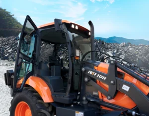 Develon DB100: Develon DB 100 cargador frontal naranja.